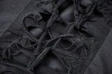 Close-up of intricate lace-up details on a black distressed dress, showcasing edgy gothic style and dramatic texture.
