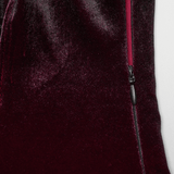Close-up of the luxurious gradient velvet fabric showcasing a side zipper on a Gothic dress.