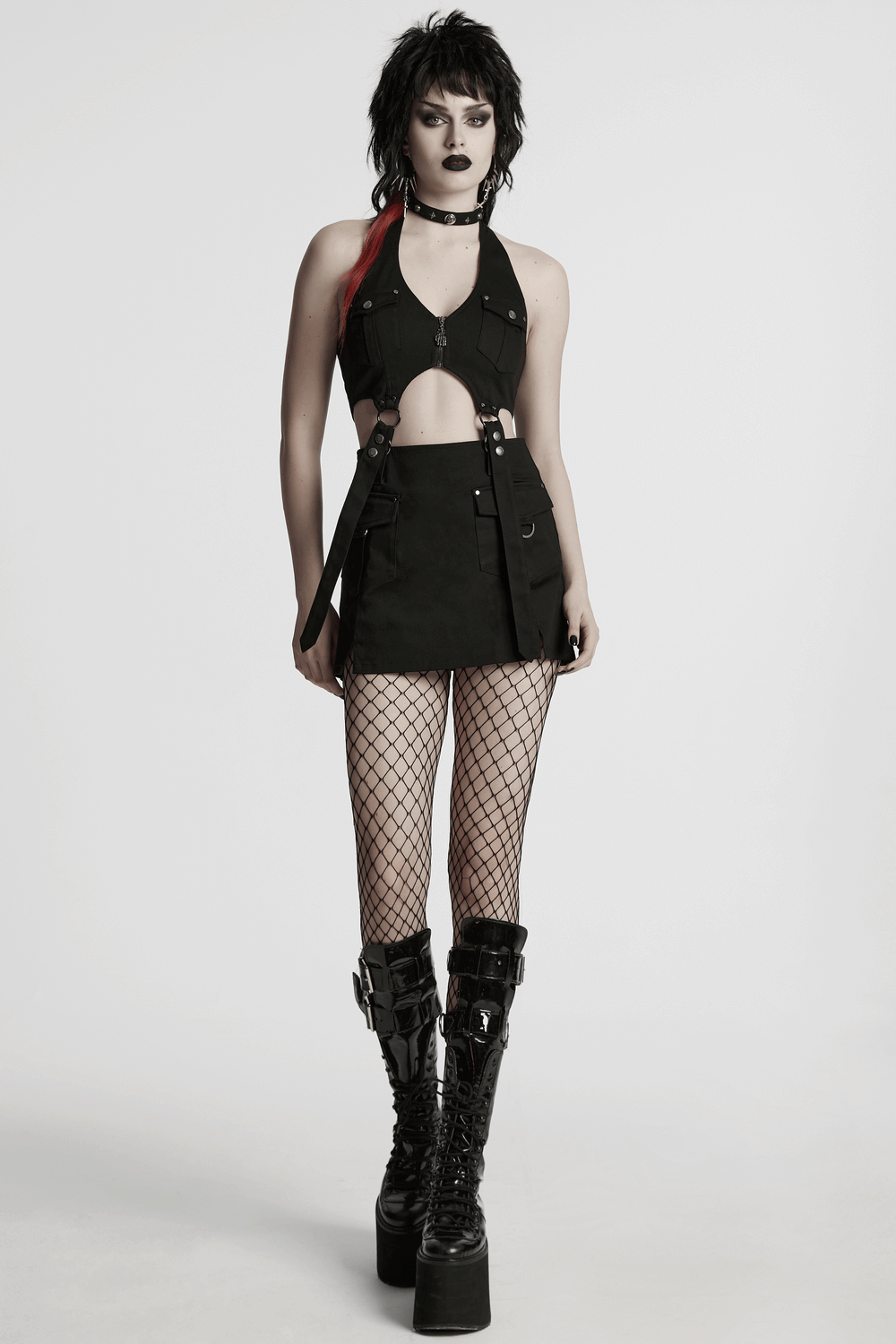 Punk halter neck dress with zippers and straps, featuring utility pockets and stylish boots.