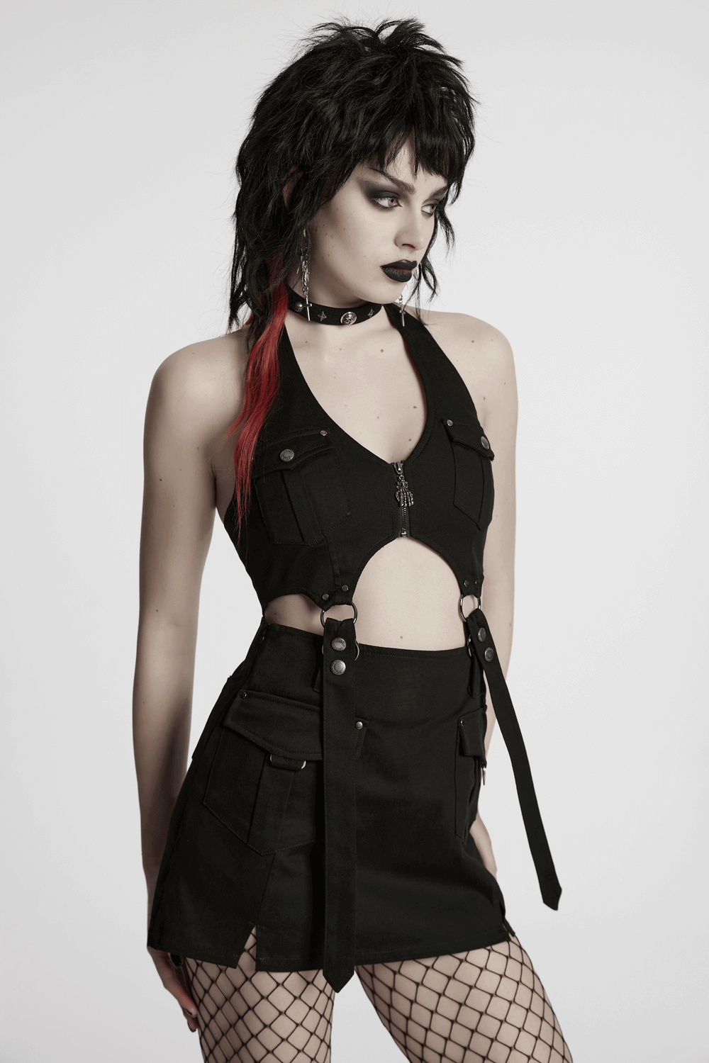 Black punk halter neck dress with zippers, utility pockets, and strap details, showcasing edgy fashion.