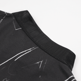 Close-up of the collar detail on a black and white gothic dress with smoky marble pattern.