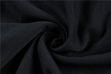 Close-up of luxurious dark fabric showcasing a rich black texture, perfect for gothic fashion styles.