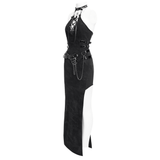 Edgy black halter dress with chains and buckles, featuring a high slit and lace-up front for alternative fashion lovers.