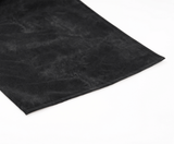 Close-up of a soft black fabric with a smooth finish, perfect for elegant textile applications.