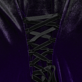 Close-up of the lace-up detail on a lavender velvet dress showcasing gothic charm and elegance.