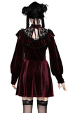 Back view of a burgundy velvet mini dress with sheer black lace yoke and ruffled accents, perfect for gothic elegance.