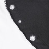 Close-up of black layered dress fabric showcasing eyelets and frayed edges for a gothic touch.