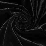 Close-up of luxurious black velvet fabric, showcasing its soft texture and elegant sheen. Perfect for gothic fashion.